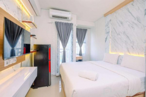 Cozy Stay and New Furnished Studio at Transpark Cibubur Apartment By Travelio